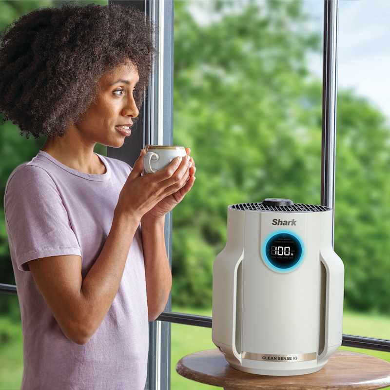 Official Shark white Compact Pro beside a window